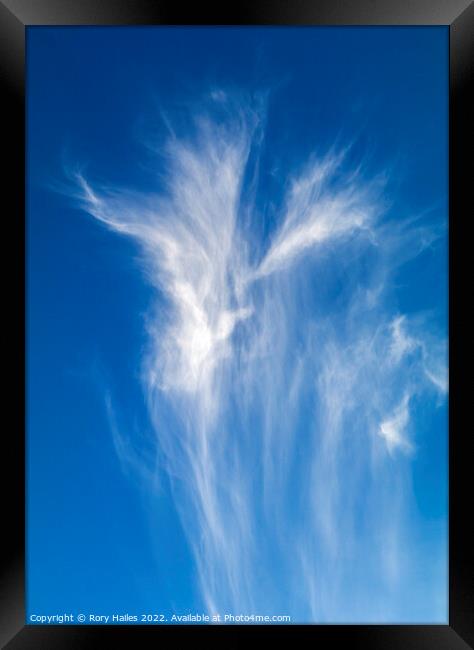 Cirrus clouds against a deep blue sky Framed Print by Rory Hailes
