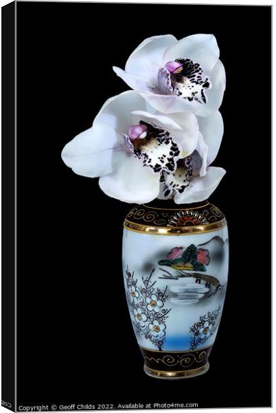  White Cymbidium Orchids in a vase on black. Canvas Print by Geoff Childs