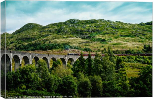 Glenfinnan Viaduct with Jacobite steam train starting to cross Canvas Print by Mehul Patel