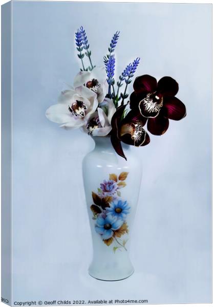  White and purple Cymbidium Orchids in a vase.  Canvas Print by Geoff Childs