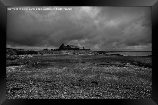 Dark skies over Bryn Aber, Cemlyn Bay, Anglesey Framed Print by Derek Daniel