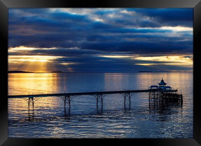 Clevedon Pier on a calm evening at sunset Framed Print by Rory Hailes