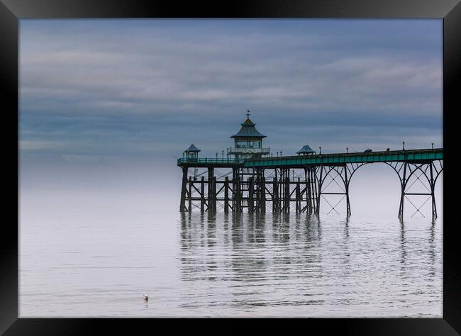 Clevedon Pier with the fog clearing Framed Print by Rory Hailes