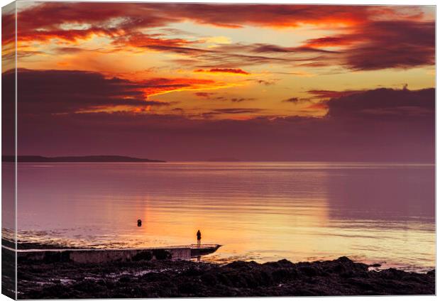 Looking out to sea at a colourful sunset Canvas Print by Rory Hailes