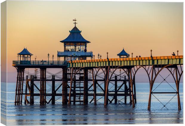 Clevedon Pier at sunset with the side panels catching some sunlight Canvas Print by Rory Hailes