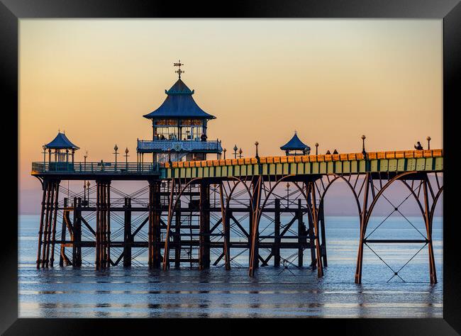 Clevedon Pier at sunset with the side panels catching some sunlight Framed Print by Rory Hailes