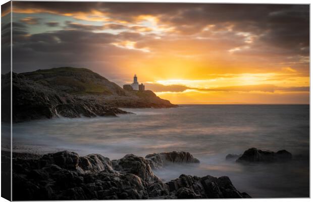 Sunrise at Mumbles lighthouse Canvas Print by Bryn Morgan