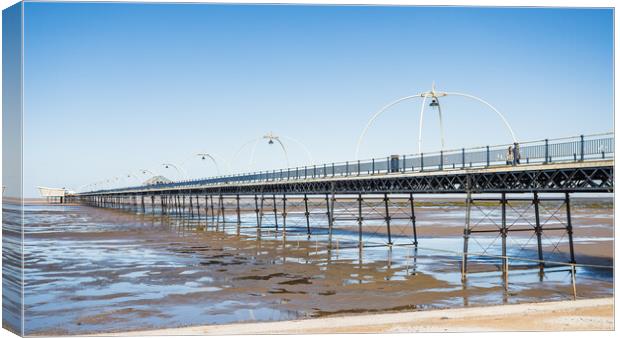 Southport Pier reflecting in pools of water Canvas Print by Jason Wells