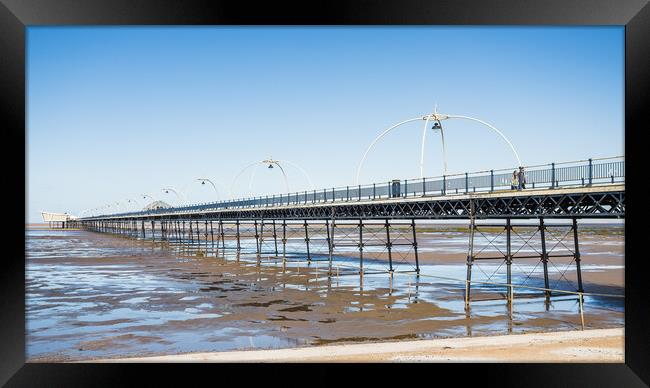 Southport Pier reflecting in pools of water Framed Print by Jason Wells