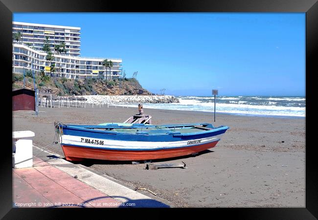 Beached rowboat, Torremolinos, Spain. Framed Print by john hill