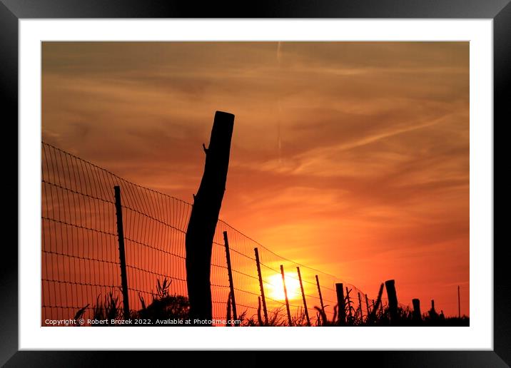 Outdoor sunset with Sun and fence silhouette Framed Mounted Print by Robert Brozek