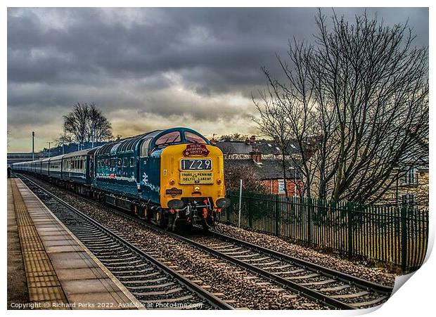 Preserved Deltic locomotive under storm clouds Print by Richard Perks