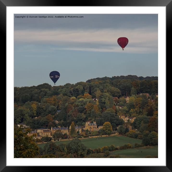 Two hot air balloons coming into land at Sham Castle in Bath Framed Mounted Print by Duncan Savidge