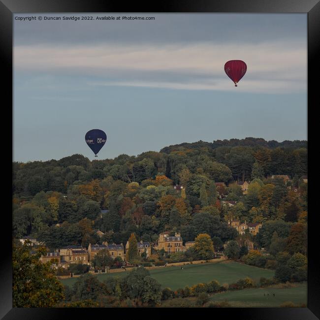 Two hot air balloons coming into land at Sham Castle in Bath Framed Print by Duncan Savidge