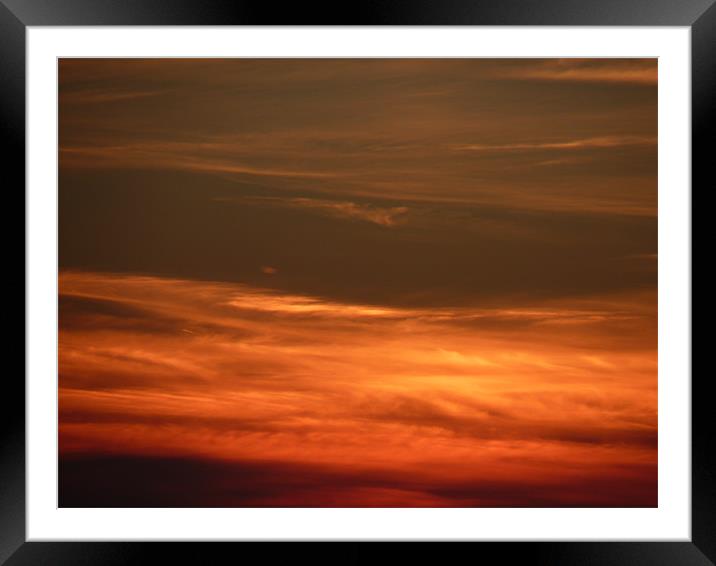 sunset clouds Framed Mounted Print by nigel watson