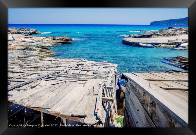 Traditional rustic pier with wooden boards in a cove in Formente Framed Print by Joaquin Corbalan