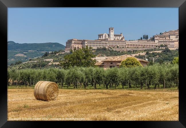 Hay roll overlooked by the Basilica di San Francesco D'Assisi, Umbria, Italy Framed Print by Kevin Hellon
