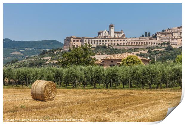 Hay roll overlooked by the Basilica di San Francesco D'Assisi, Umbria, Italy Print by Kevin Hellon