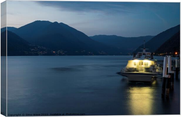Boat at jetty in Como Lake Canvas Print by Simo Wave