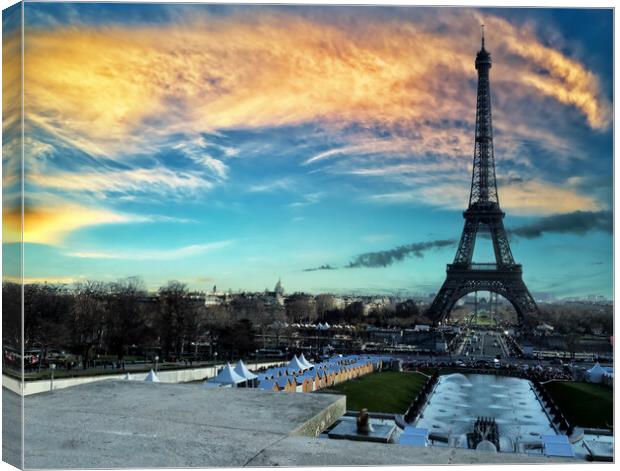 Eiffel Tower at sunset located in Paris, France Canvas Print by Thomas Baker