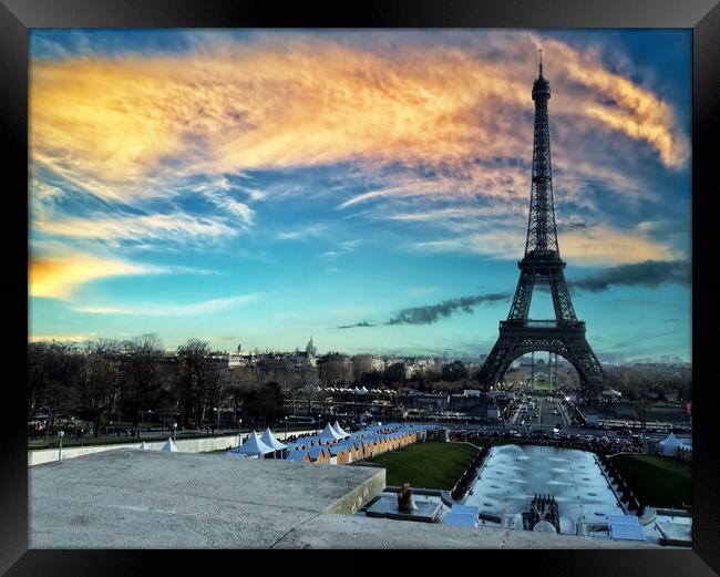 Eiffel Tower at sunset located in Paris, France Framed Print by Thomas Baker