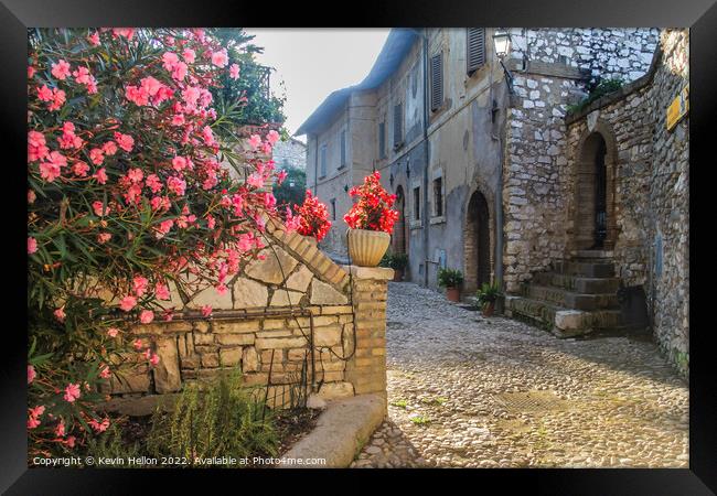 Narrow, cobbled street with flowers, Framed Print by Kevin Hellon