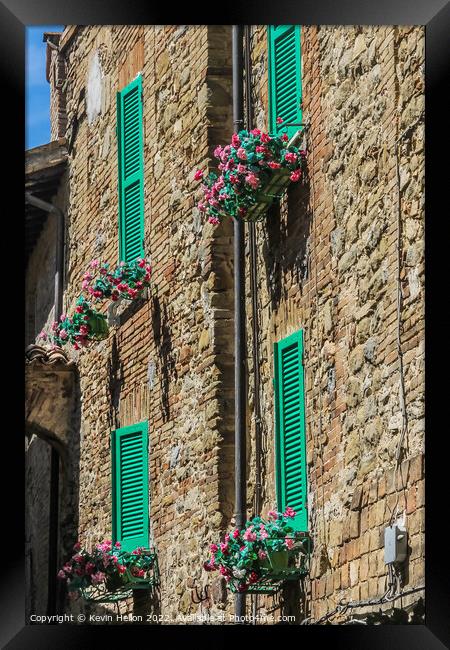Colourful shutters on a house in Bevagna, Umbria, Italy Framed Print by Kevin Hellon