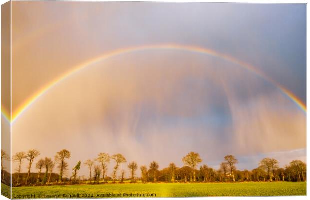Rainbow over stormy sky in rural Brittany Canvas Print by Laurent Renault