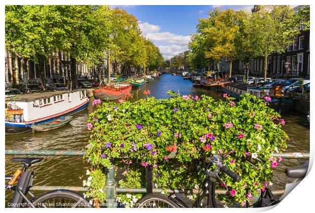 Bike, flowers on bridge over canal in Amsterdam Print by Michael Shannon