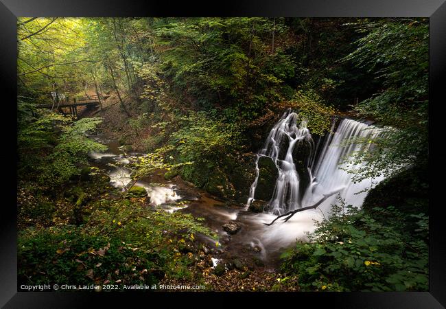 A waterfall in the woods Framed Print by Chris Lauder