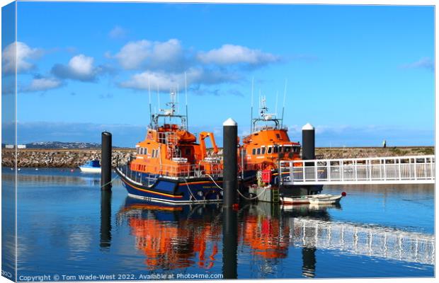 Lifeboats in Brixham Harbour Canvas Print by Tom Wade-West