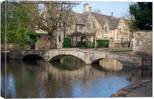 Bourton-on-the-Water bridge Canvas Print by Christopher Keeley