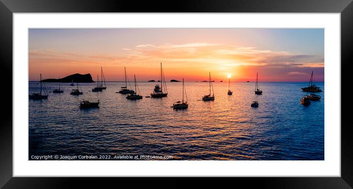 Several yachts and boats anchored near the coast relax watching  Framed Mounted Print by Joaquin Corbalan