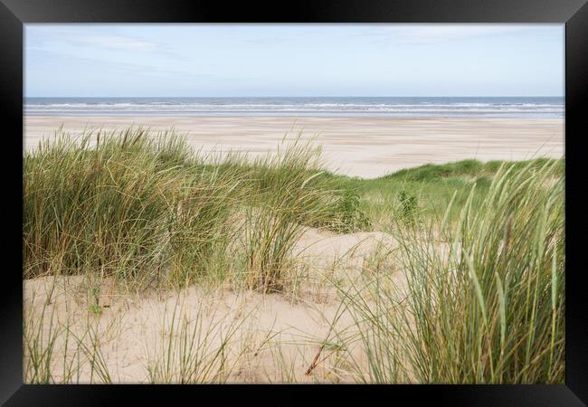 Ainsdale beach over the sand dunes Framed Print by Jason Wells