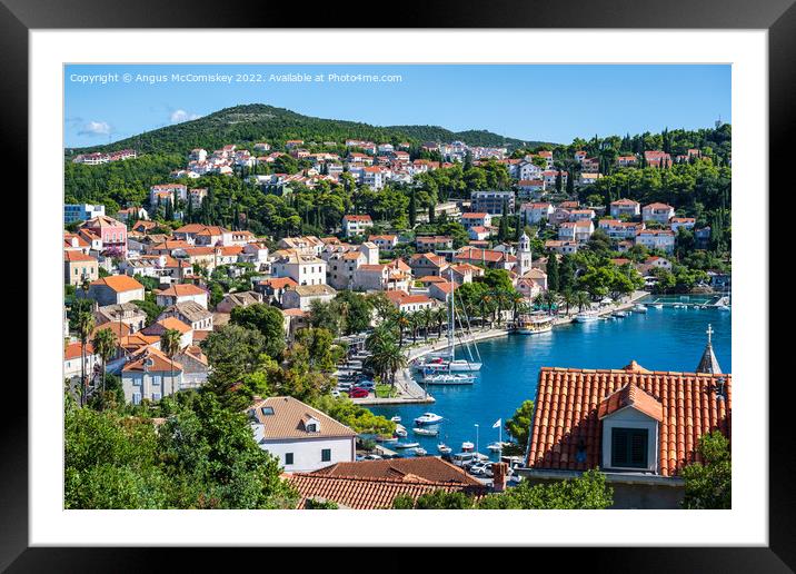 Looking down on Cavtat harbour in Croatia Framed Mounted Print by Angus McComiskey