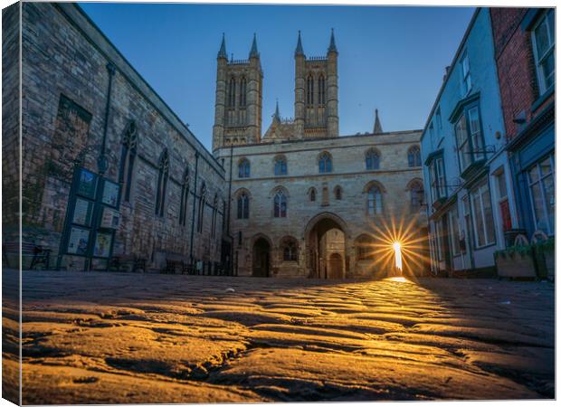 Sun lights up the cobbles - Lincoln Cathedral Canvas Print by Andrew Scott