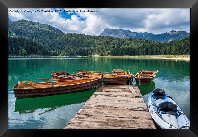 Rowing boats on the Black Lake in Montenegro Framed Print by Angus McComiskey