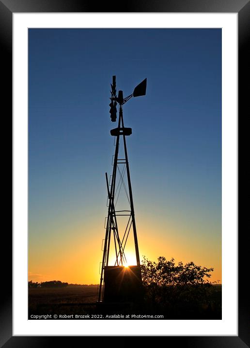 Kansas Windmill silhouette at Sunset Framed Mounted Print by Robert Brozek