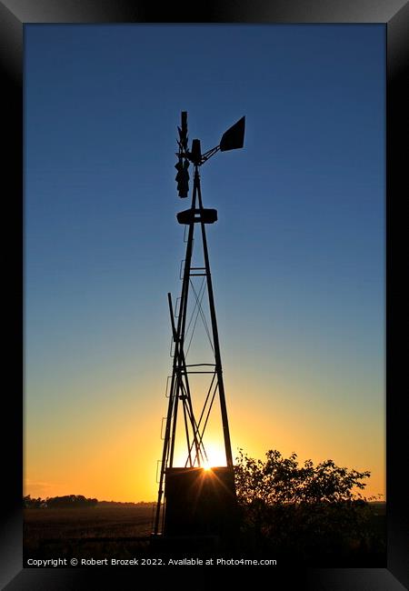 Kansas Windmill silhouette at Sunset Framed Print by Robert Brozek