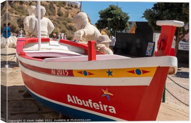 Boat and stone statues, Albufeira old town, Canvas Print by Kevin Hellon