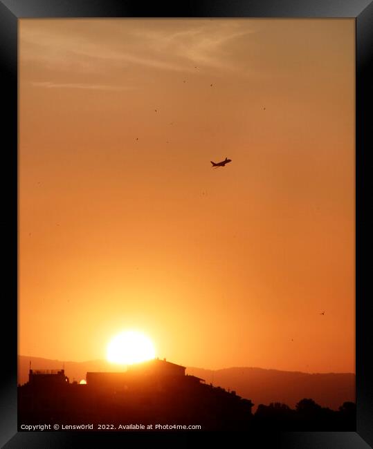 Airplane rising into the sky during sunset Framed Print by Lensw0rld 