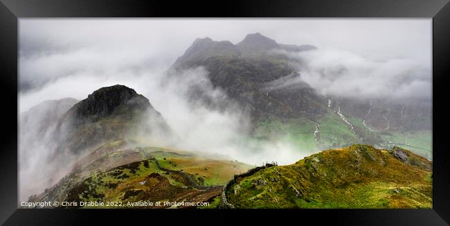 The Langdale pikes in the grip of a storm Framed Print by Chris Drabble