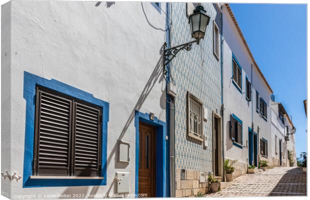 Narrow, steep street, Albufeira old town, Canvas Print by Kevin Hellon