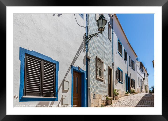 Narrow, steep street, Albufeira old town, Framed Mounted Print by Kevin Hellon