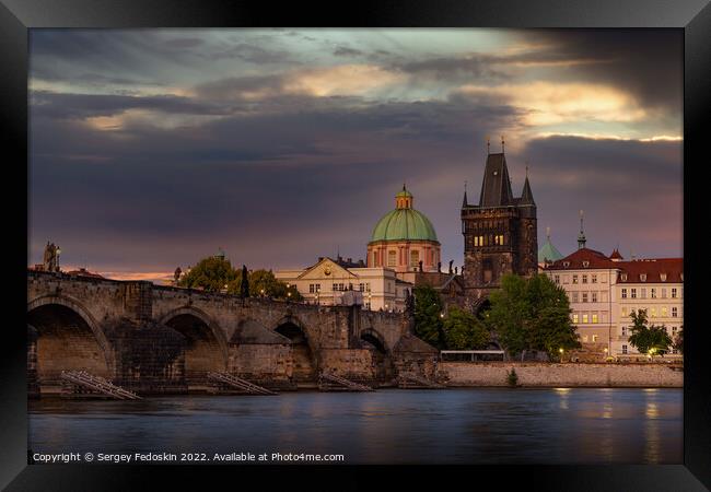 Colorful sunset view on old town, Charles bridge (Karluv Most - in czech) and Vltava river, Prague, Czech Republic. Framed Print by Sergey Fedoskin