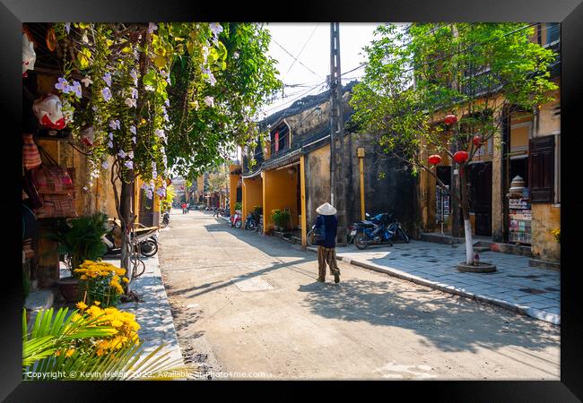 Typical street, Hoi An, Vietnam Framed Print by Kevin Hellon