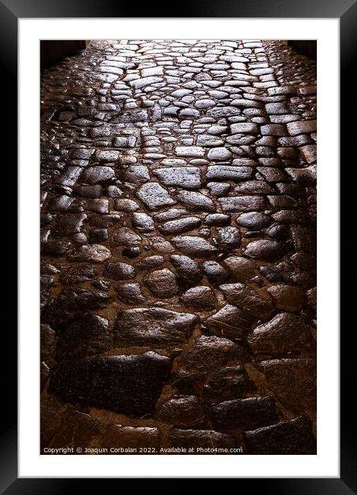 Ancient roman pavement with smooth stones, background and textur Framed Mounted Print by Joaquin Corbalan