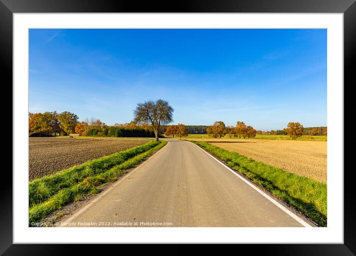 Sunny autumn day in european countryside. Rural road. Czech Republic. Framed Mounted Print by Sergey Fedoskin