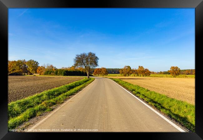 Sunny autumn day in european countryside. Rural road. Czech Republic. Framed Print by Sergey Fedoskin