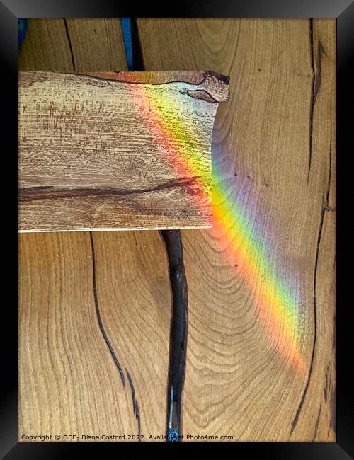 Rainbow rays over timber Framed Print by DEE- Diana Cosford